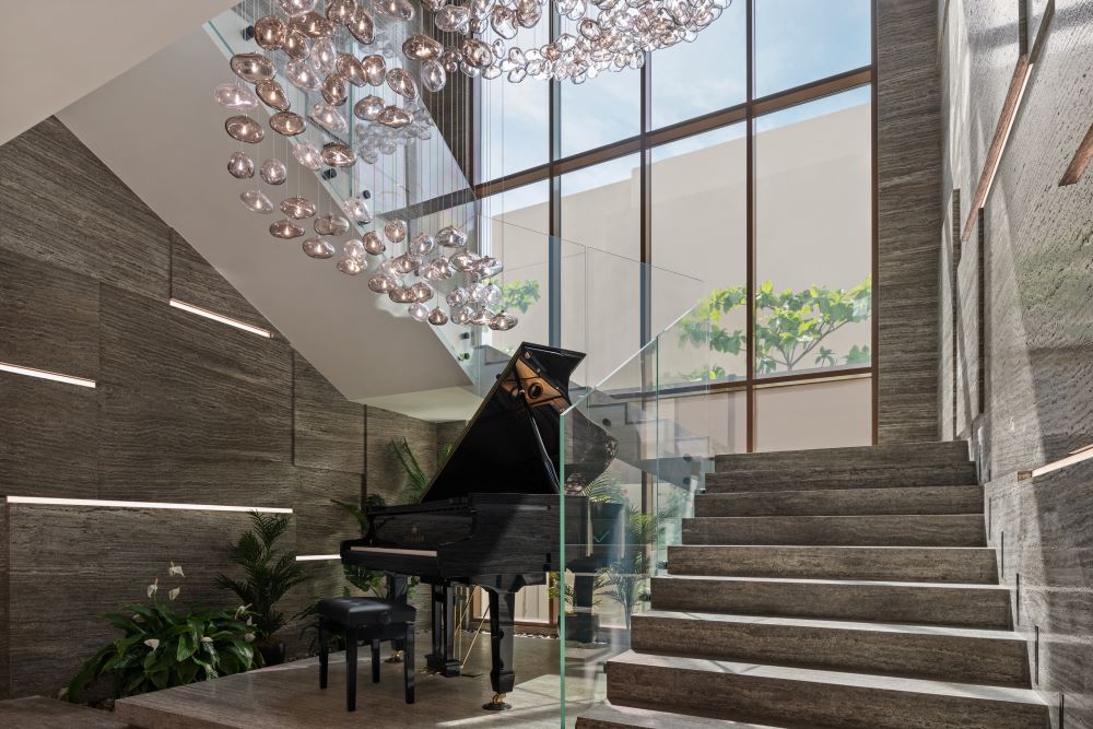 chandelier_marble_staircase_light_strips_indoor_garden_piano