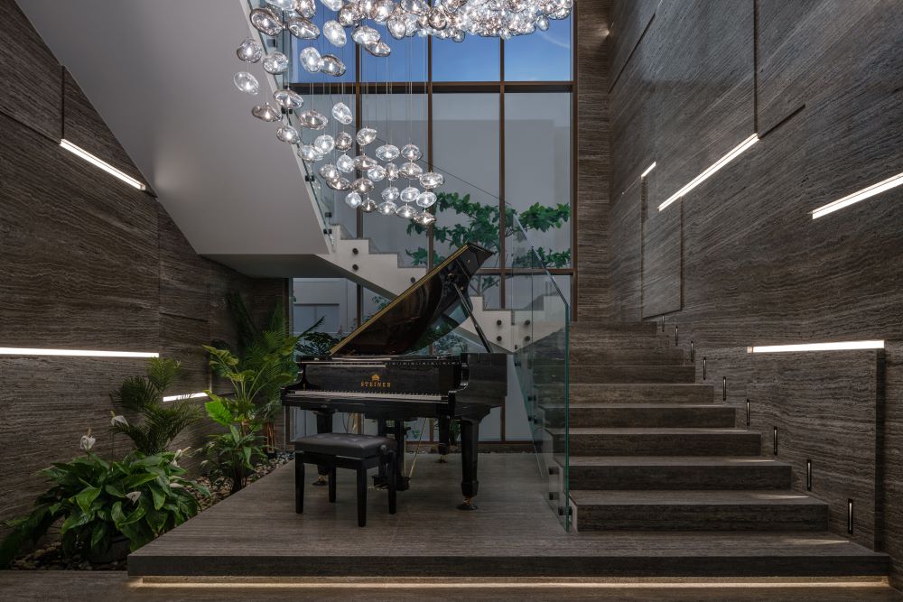 indoor_garden_marble_staircase_light_strips_chandelier_piano